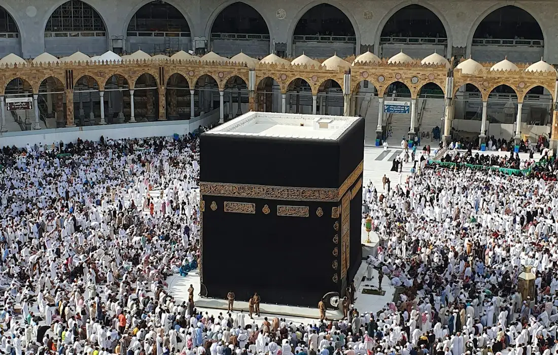 Pilgrims performing Tawaf around the Kaaba in Masjid al-Haram, Makkah, at the end of the Umrah journey from the UK